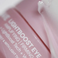 Solawave Light Therapy Boosting Eye Cream in a sleek white jar, designed to reduce puffiness and brighten the eye area.