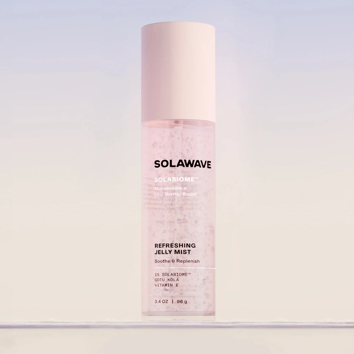 Solawave Pre- & Probiotic Refreshing Jelly Mist for skincare, featuring a clear bottle with a spray nozzle and refreshing mist inside.