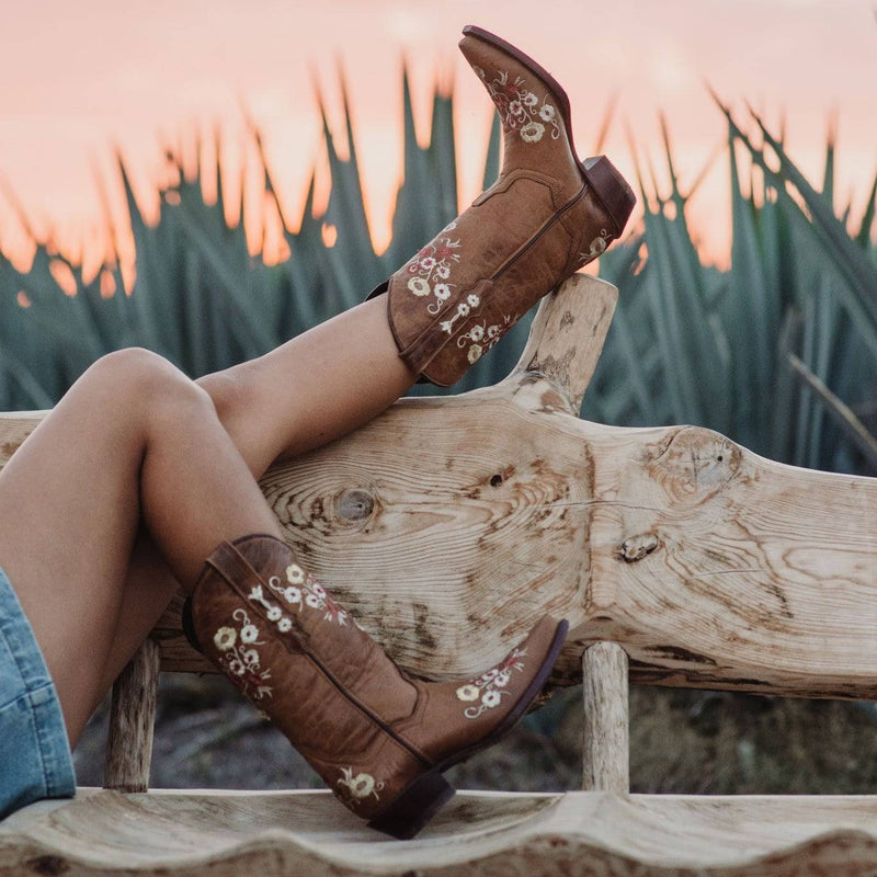 Women's floral showstopper cowboy boots by Soto Boots with snipped toe and tan leather, featuring intricate floral embroidery.