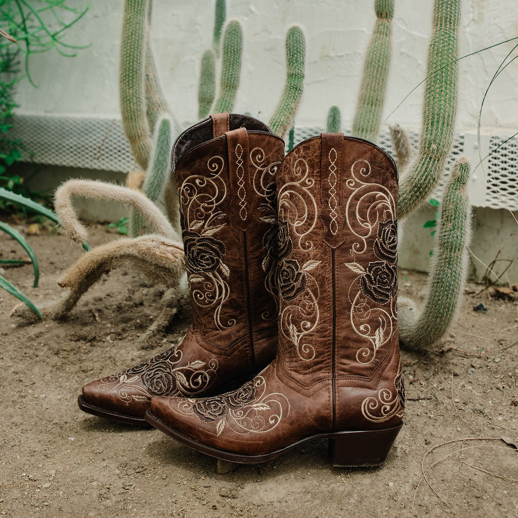 Tan Soto Boots women's cowgirl boots with rose inlay design, featuring pointed toes and Western stitching.