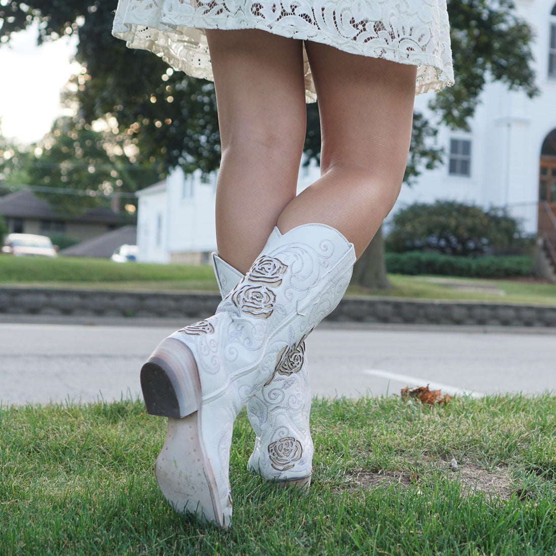 White rose inlayed women's cowgirl boots by Soto Boots, featuring detailed floral embroidery and classic western style.