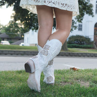 White rose inlayed women's cowgirl boots by Soto Boots, featuring detailed floral embroidery and classic western style.