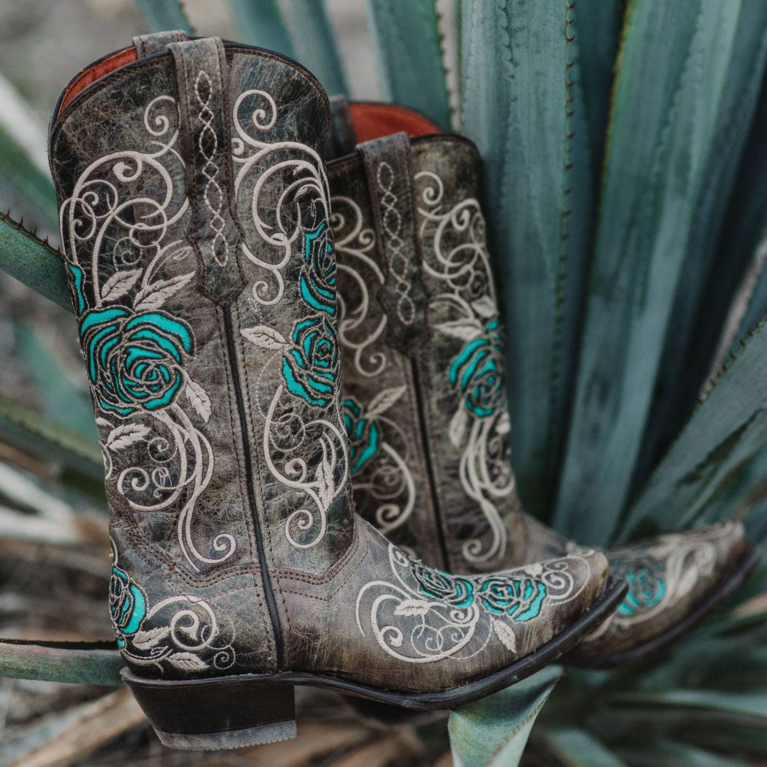 Tan and turquoise Soto Boots cowgirl boots with rose inlay design for women, featuring traditional Western style and detailed craftsmanship.