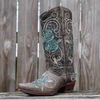 Brown women's cowgirl boots by Soto Boots with turquoise rose inlay, featuring detailed stitching and classic Western style.