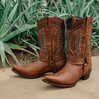 Brown leather women's harness boots with cowboy style, featuring classic saddle details and sturdy heel from Soto Boots.