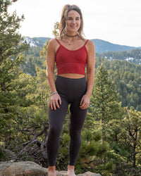 Empower Luxe leggings by Soul Fire Apparel Co, close-up of black high-waisted athletic leggings with subtle branding details.
