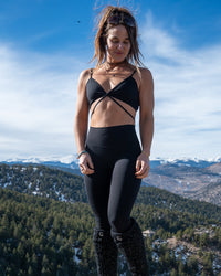 Wild Sports Bra by Soul Fire Apparel Co, featuring a close-up of the black and pink athletic bra with breathable fabric and supportive design.