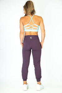 Soul Fire Apparel Co Hatha Sports Bra with supportive design and breathable fabric, shown on a hanger.
