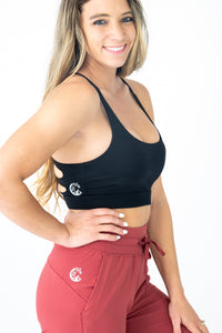 Soul Fire Apparel Co Hatha Sports Bra in black, showcasing supportive design and moisture-wicking fabric for active wear.