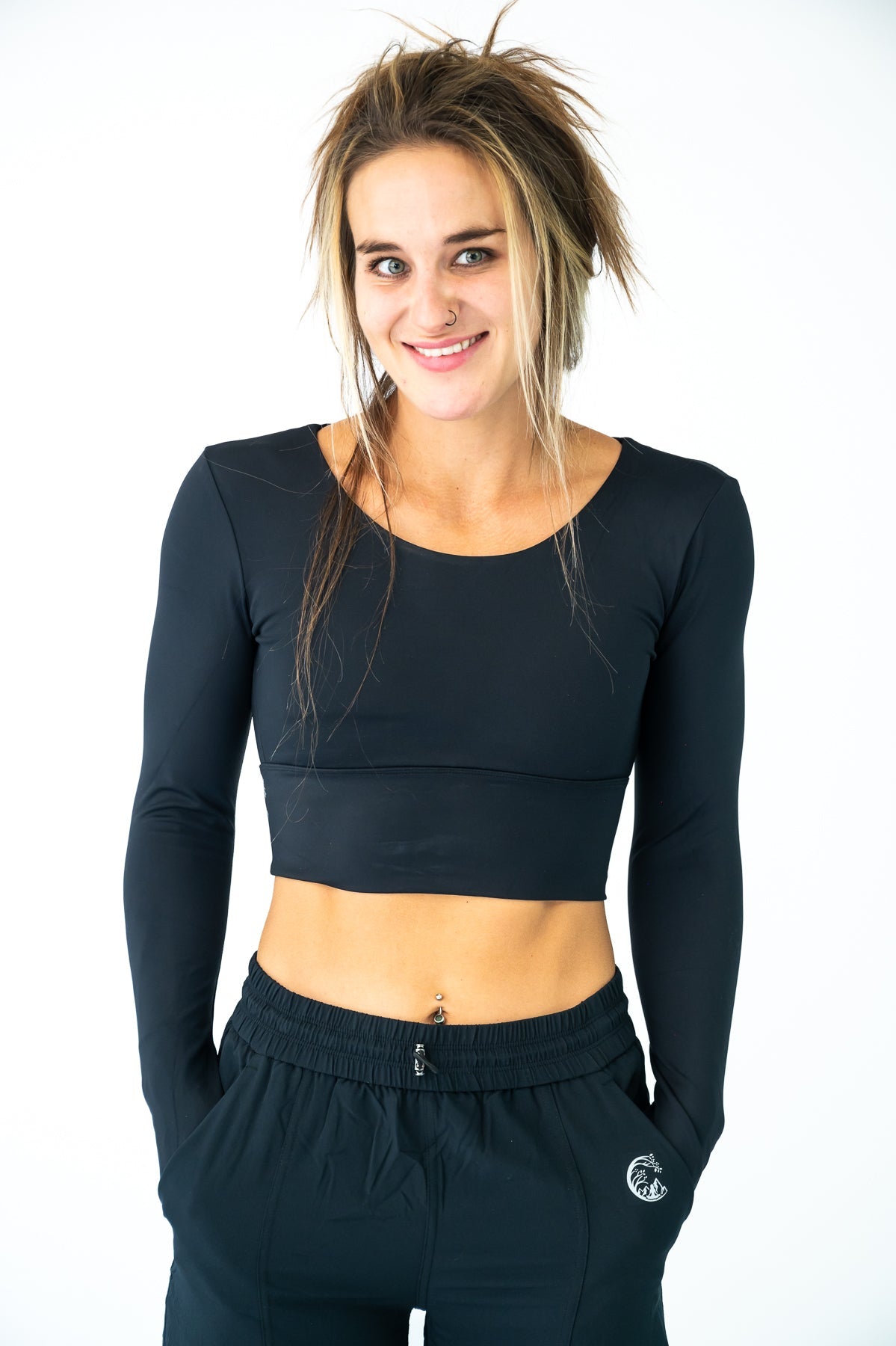 Soul Fire Apparel Co Classic Aya Crop-Long Sleeve top in black, featuring a fitted design and long sleeves, displayed on a hanger.