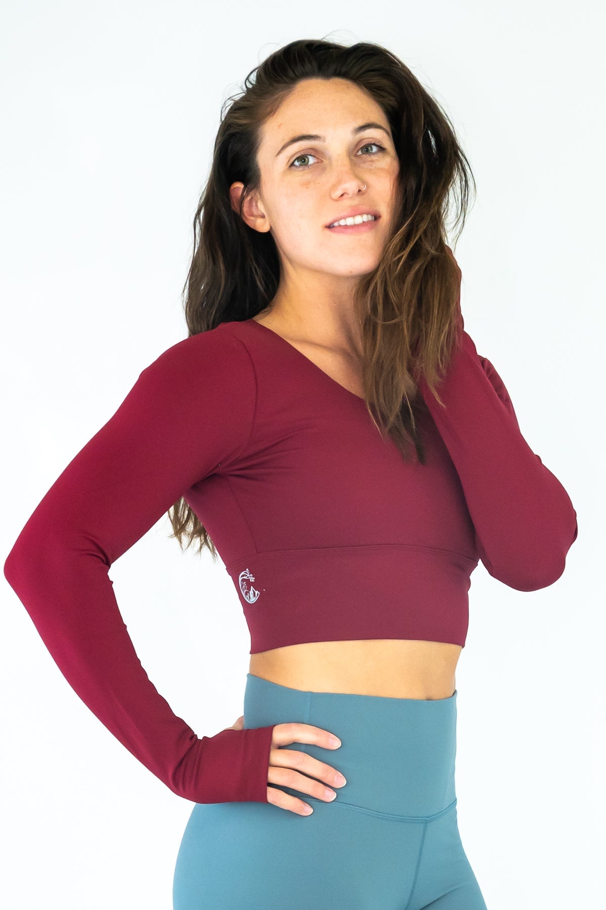 Soul Fire Apparel Co Classic Aya Crop-Long Sleeve top, featuring a stylish crop design and long sleeves, displayed on a hanger.