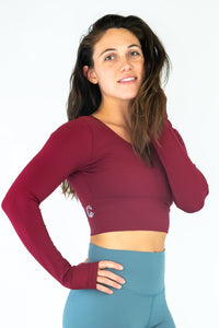 Soul Fire Apparel Co Classic Aya Crop-Long Sleeve top, featuring a stylish crop design and long sleeves, displayed on a hanger.