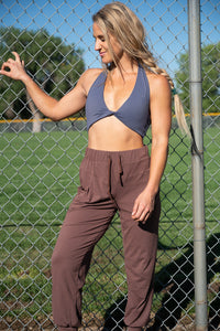 Soul Fire Apparel Co Amaryllis sports bra top with supportive design, shown in a vibrant color on a model.