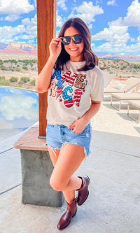 Yellow Retro America graphic T-shirt from Sugar Stitch Wholesale, casual cotton tee with vintage patriotic design.