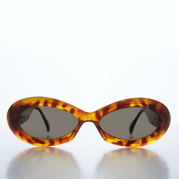 Classic chunky oval women's sunglasses by Sunglass Museum featuring bold frames and dark tinted lenses.