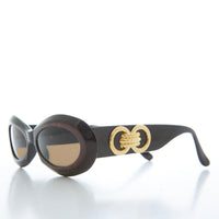 Classic chunky oval women's sunglasses by Sunglass Museum featuring bold frames and tinted lenses for a stylish look.