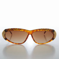 Women's 80s vintage sunglasses by Sunglass Museum, Rachel style with bold frames and tinted lenses.