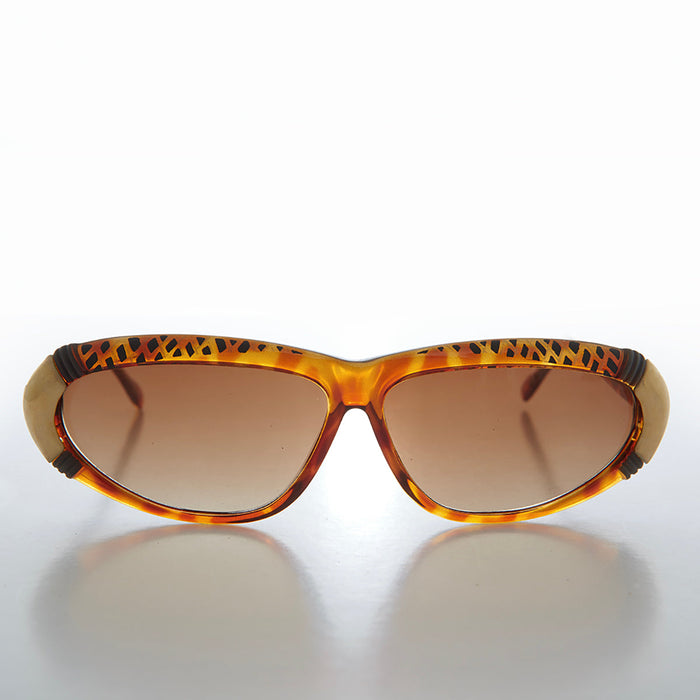Women's 80s vintage sunglasses by Sunglass Museum, Rachel style with bold frames and tinted lenses.