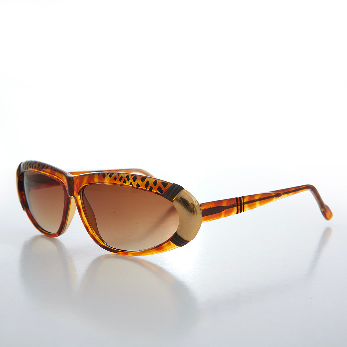 Women's 80s vintage sunglasses by Sunglass Museum, Rachel style with bold frames and retro design, shown on a model.