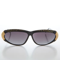 Vintage women's 80s sunglasses by Sunglass Museum, stylish Rachel frame with dark lenses and retro design.