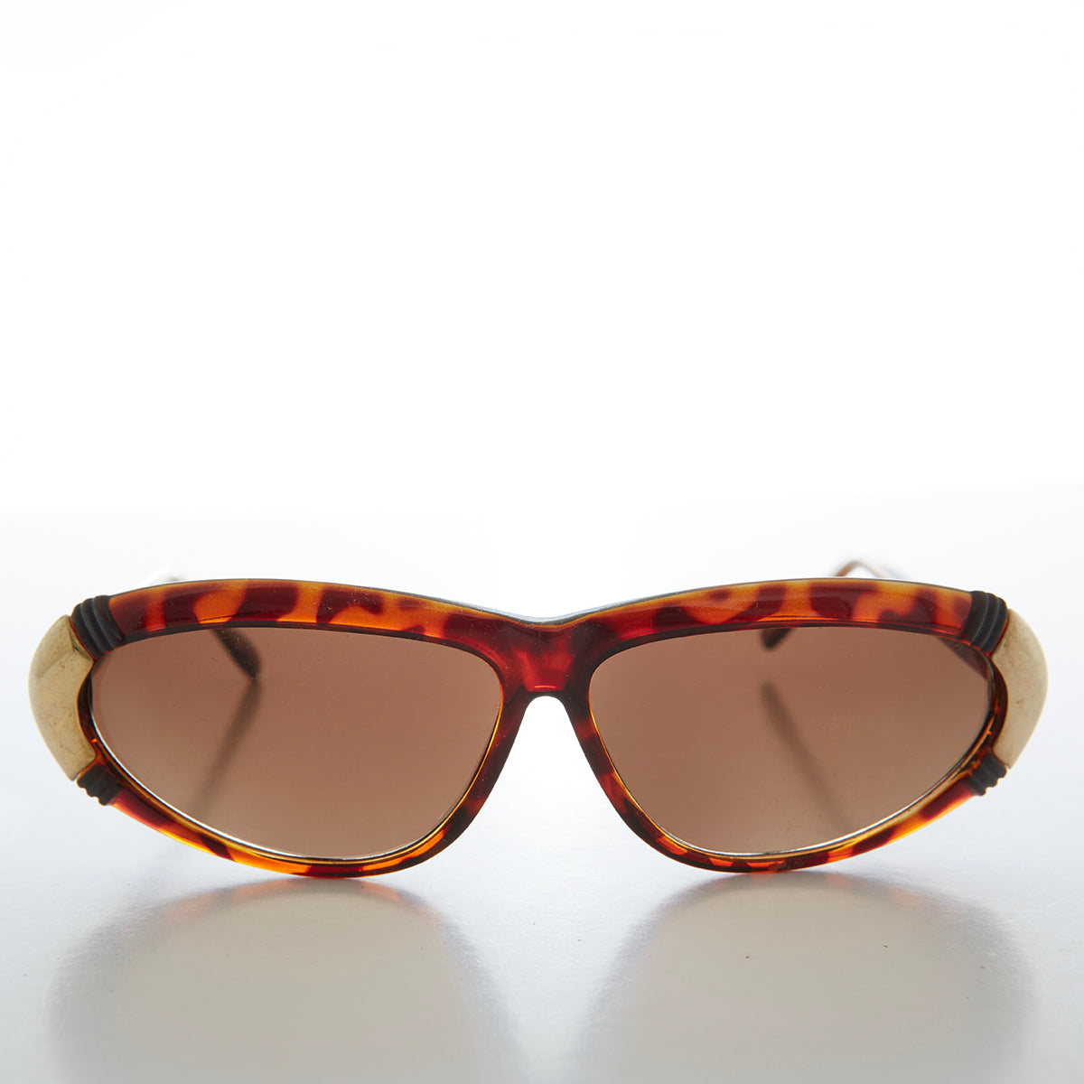 Vintage women's 80s sunglasses by Sunglass Museum, Rachel style with bold frames and retro design.