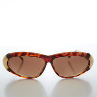 Vintage women's 80s sunglasses by Sunglass Museum, Rachel style with bold frames and retro design.