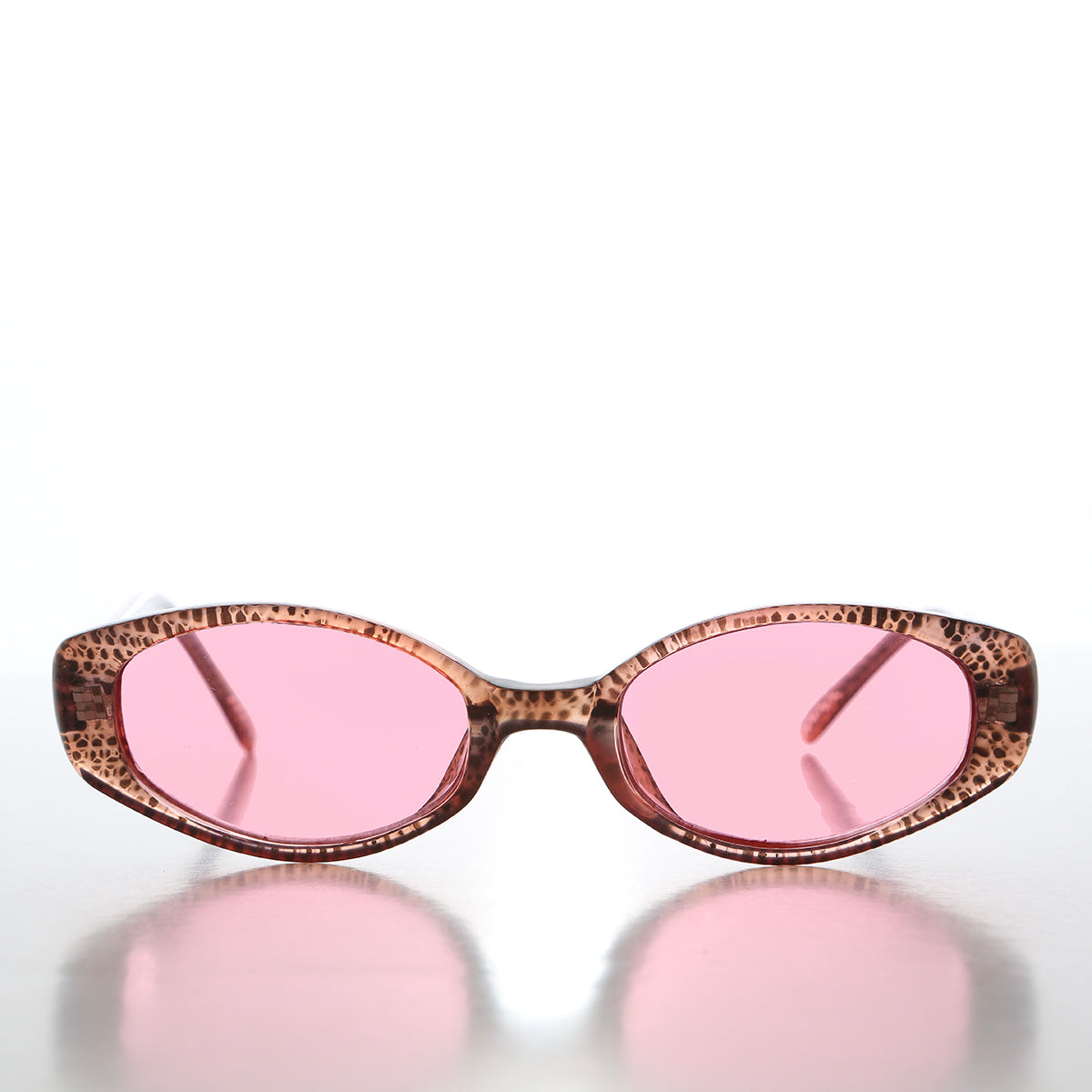 90s oval sunglasses with tinted lenses by Sunglass Museum, featuring a sleek frame and stylish vintage-inspired design.