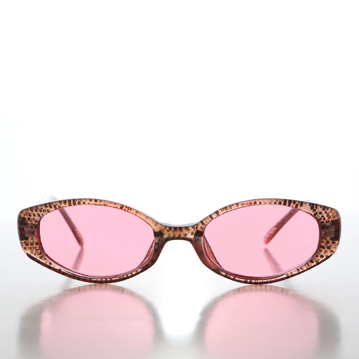 90s oval sunglasses with tinted lenses by Sunglass Museum, featuring a sleek frame and stylish vintage-inspired design.