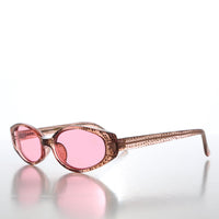 90s oval sunglasses with tinted lenses by Sunglass Museum, featuring retro-inspired design and sleek frame.
