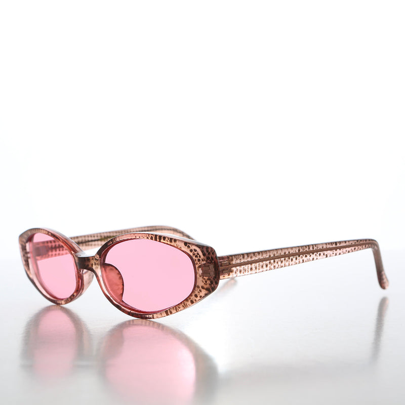 90s oval sunglasses with tinted lenses by Sunglass Museum, featuring retro-inspired design and sleek frame.