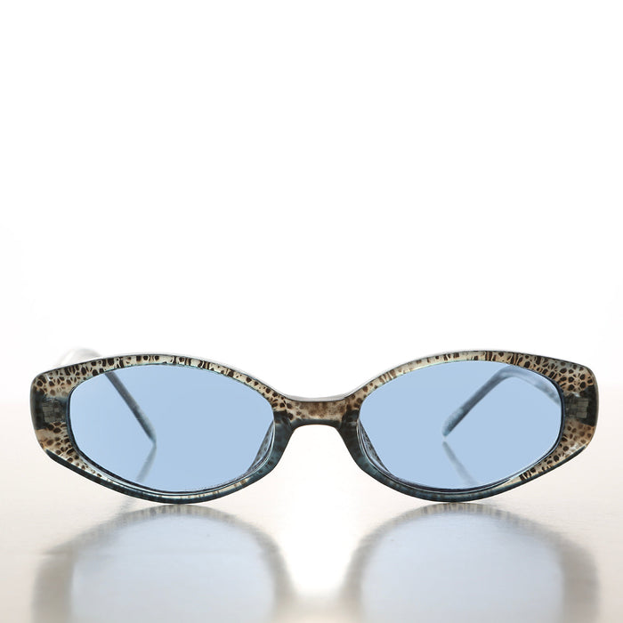 90s oval sunglasses with tinted lenses by Sunglass Museum featuring a stylish vintage design.