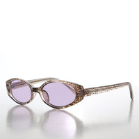 Helena 90s oval sunglasses with tinted lenses and black frames, stylish retro eyewear from Sunglass Museum.