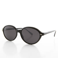 Women's large oval vintage sunglasses by Sunglass Museum featuring retro glamour and stylish oval frames.
