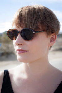 Women's large oval vintage sunglasses by Sunglass Museum featuring glamorous style and classic design.