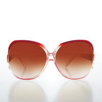 Red oversized 80s women's sunglasses by Sunglass Museum featuring bold, round frames and retro style.