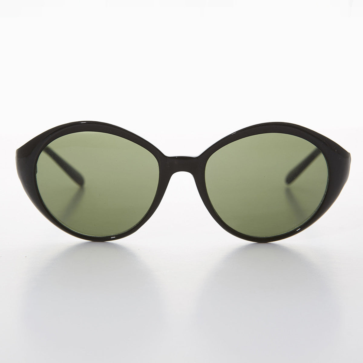Round women's vintage sunglasses by Sunglass Museum with black frames and green-tinted lenses.