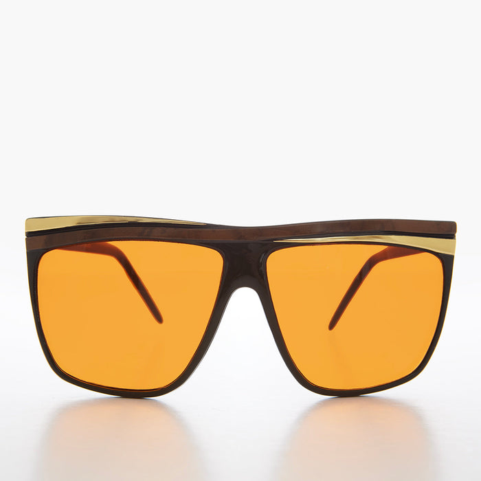 Women's 80s large sunglasses with orange lenses by Sunglass Museum featuring bold retro style and oversized frame.