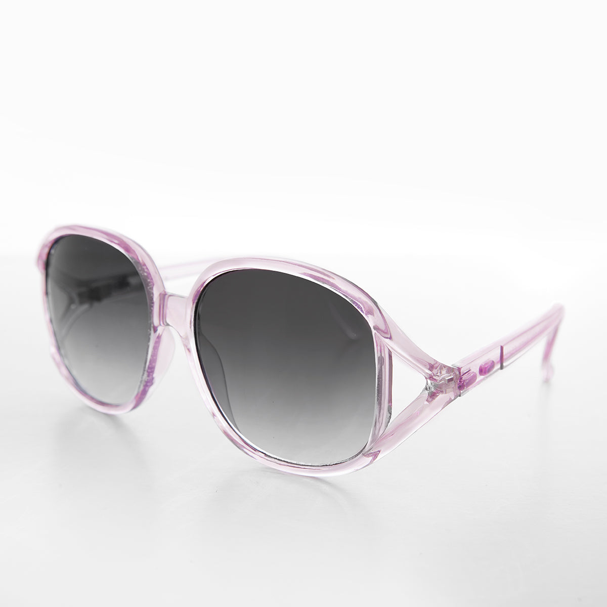 Large pink round oversized women's boho vintage sunglasses by Sunglass Museum with bold frames and retro style.