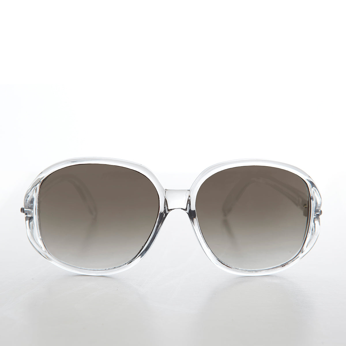 Large pink oversized boho vintage sunglasses for women by Sunglass Museum, with round frames and trendy style.