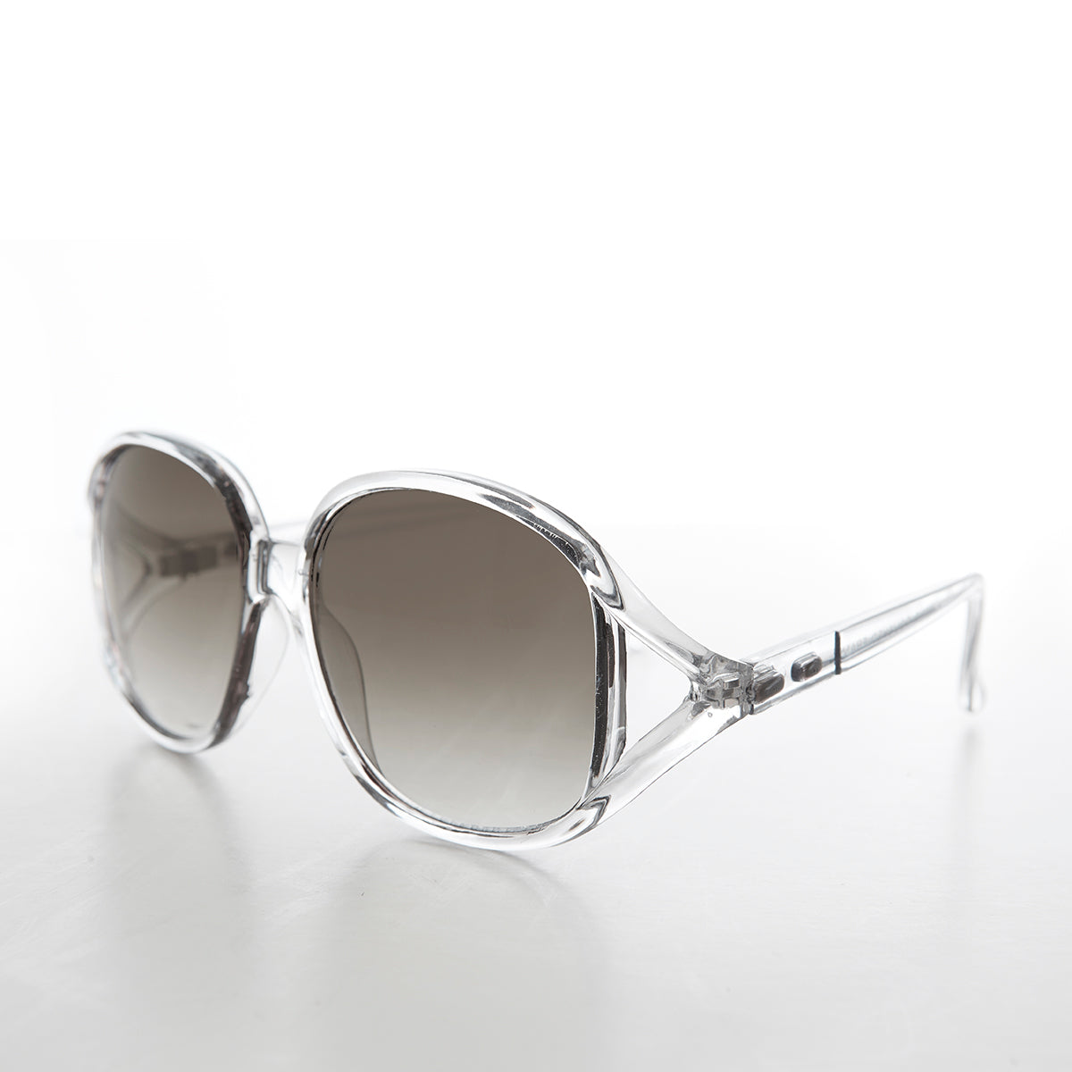 Large round oversized women's boho vintage sunglasses by Sunglass Museum with pink tinted lenses and stylish frame.