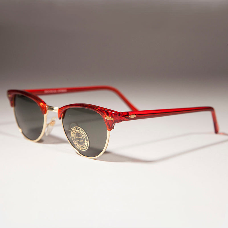 Colorful Brow Line Half Frame Women's Vintage Sunglasses by Sunglass Museum featuring vibrant hues and retro style.