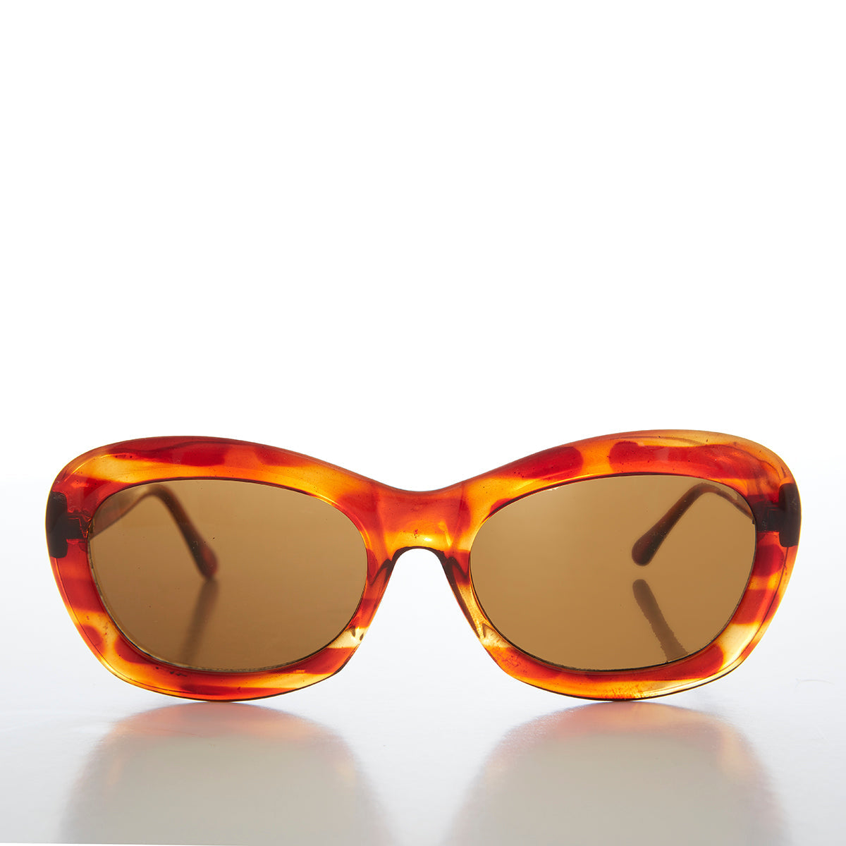 Large tortoise shell cat eye women's sunglasses with green lenses by Sunglass Museum, stylish and fashionable eyewear for women.