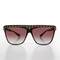 Vintage 80s rhinestone women's sunglasses by Sunglass Museum featuring retro frame and sparkling embellishments.
