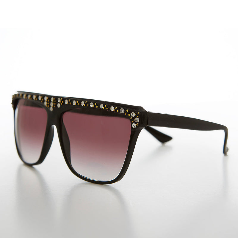 Vintage 80s rhinestone women's sunglass by Sunglass Museum featuring bold frames and sparkling rhinestone accents.