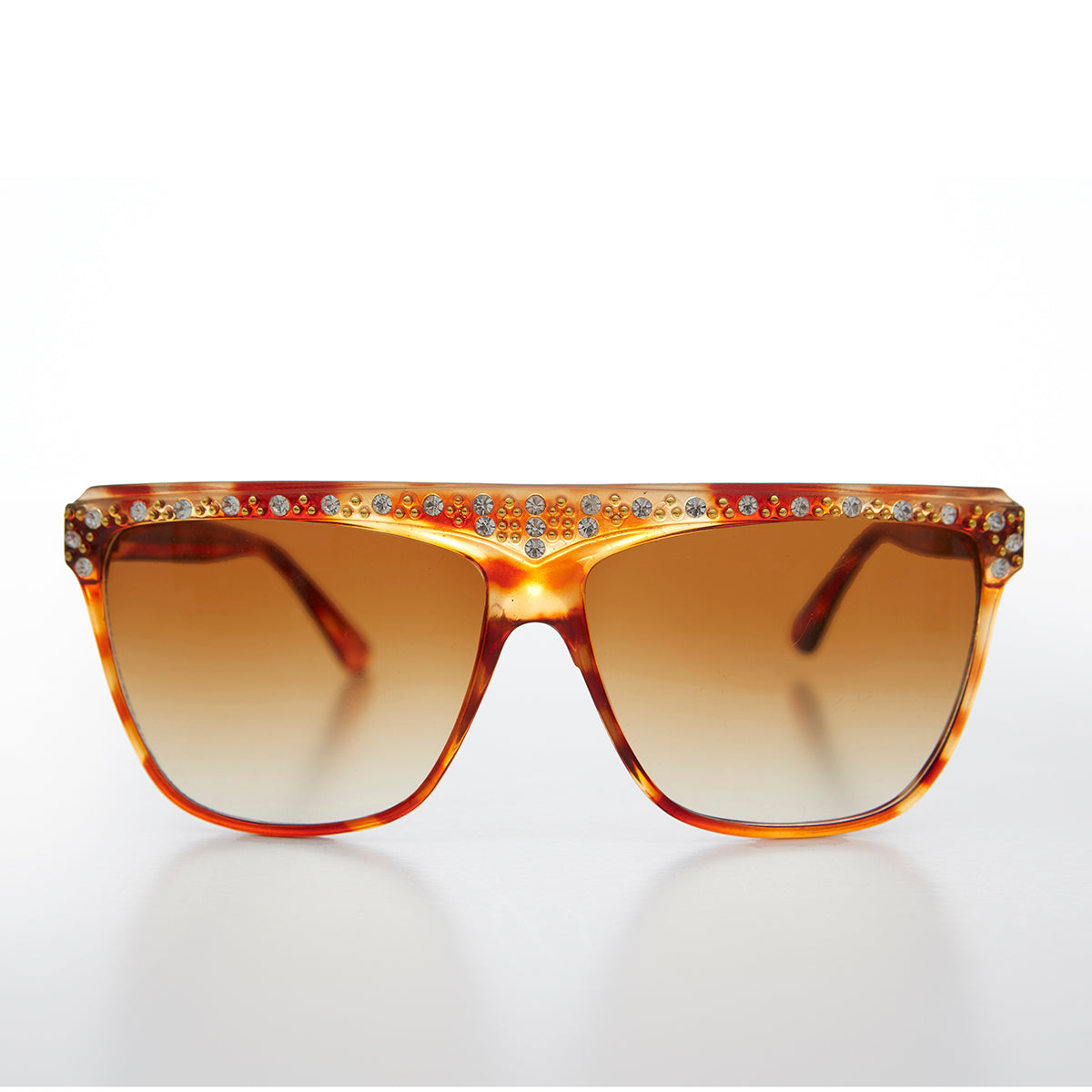 Vintage 80s rhinestone women's sunglasses by Sunglass Museum featuring bold frames and sparkling rhinestone details.