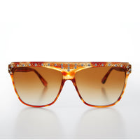Vintage 80s rhinestone women's sunglasses by Sunglass Museum featuring bold frames and sparkling rhinestone details.