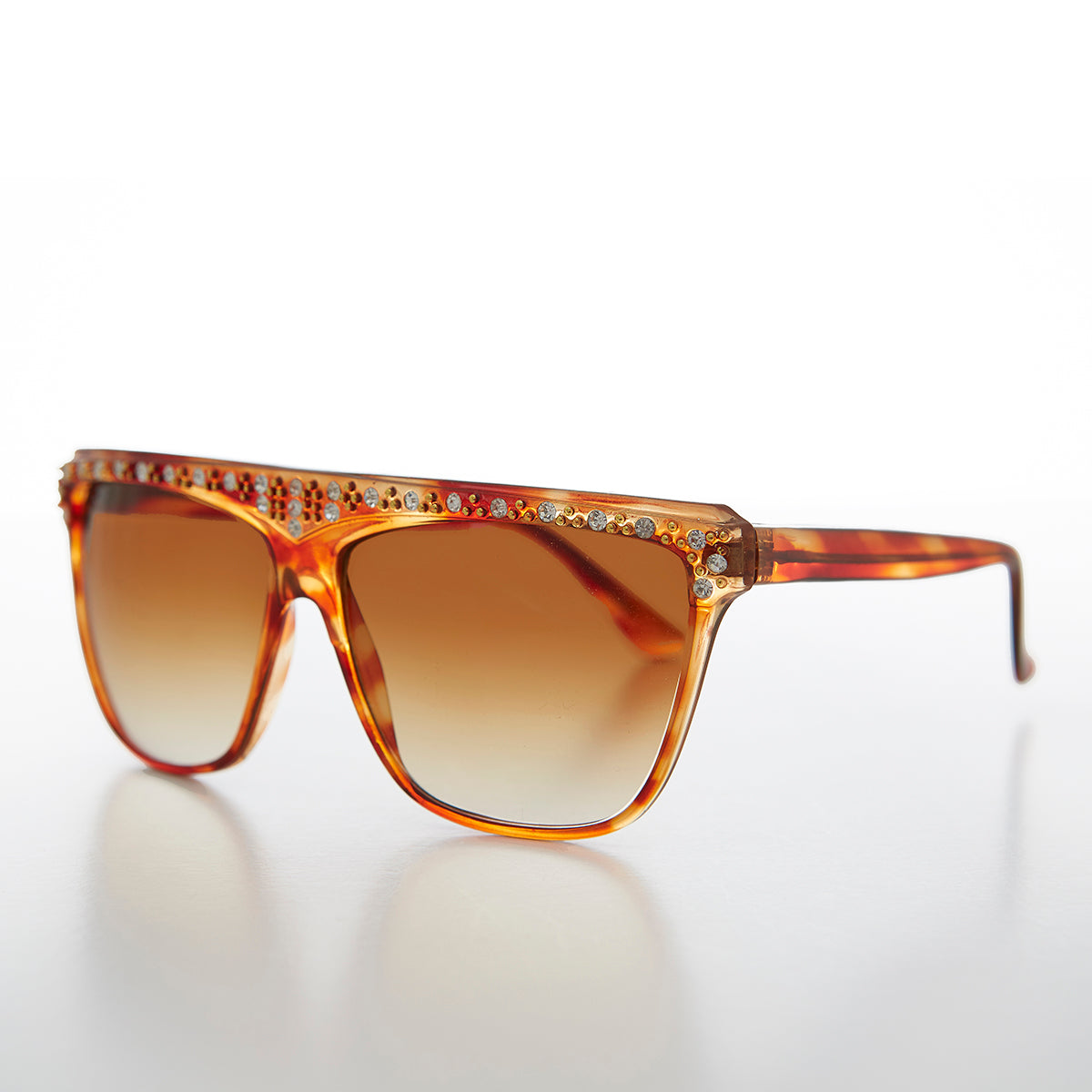 Vintage 80s Rhinestone Women's Sunglass by Sunglass Museum featuring retro frame and sparkling rhinestone accents.
