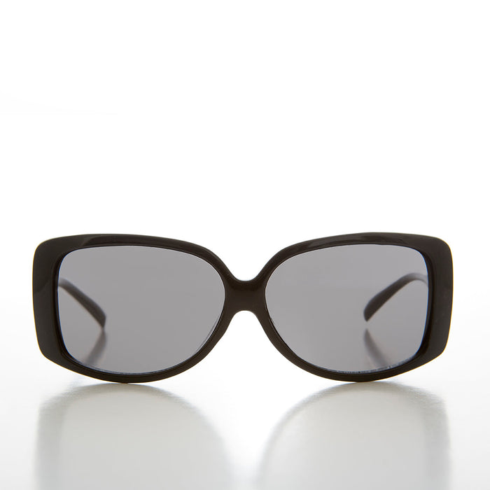 Women's 90s vintage drop temple sunglasses by Sunglass Museum with black frames and gray lenses.