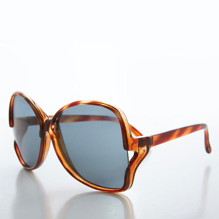 Large 80s butterfly women's sunglasses by Sunglass Museum featuring bold, oversized frames in black with tinted lenses.