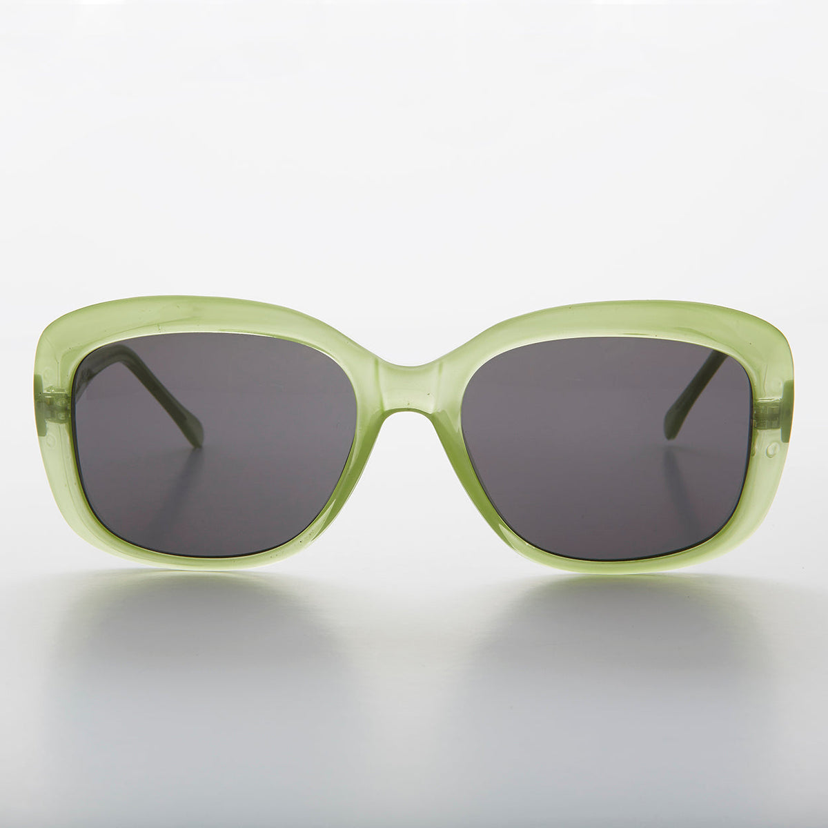 Green square vintage women's sunglasses by Sunglass Museum with retro style and classic design.